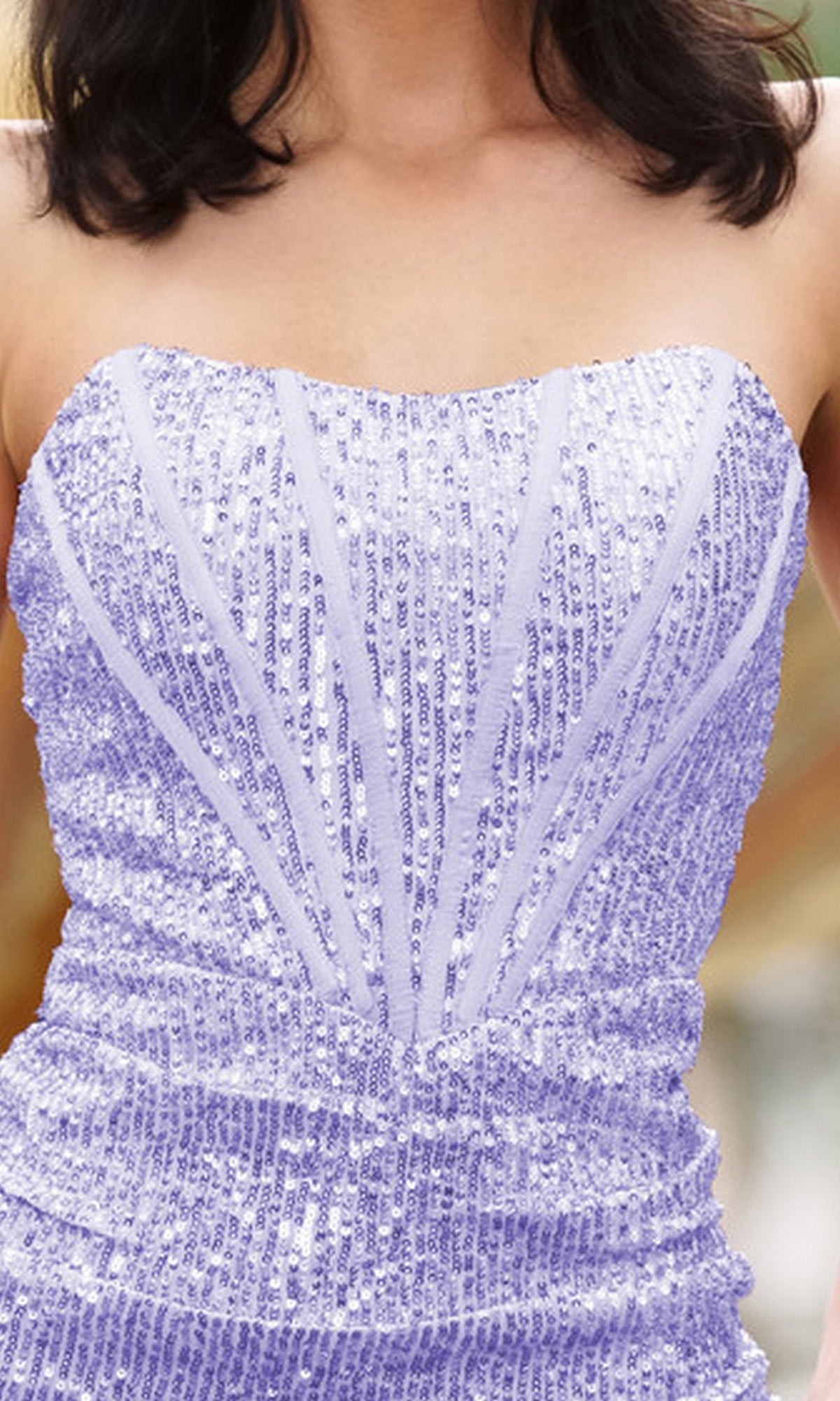 A woman wears the Gia Strapless Sequin Short Homecoming Party Dress—an affordable, fitted lavender cocktail dress with vertical and diagonal sequin patterns.